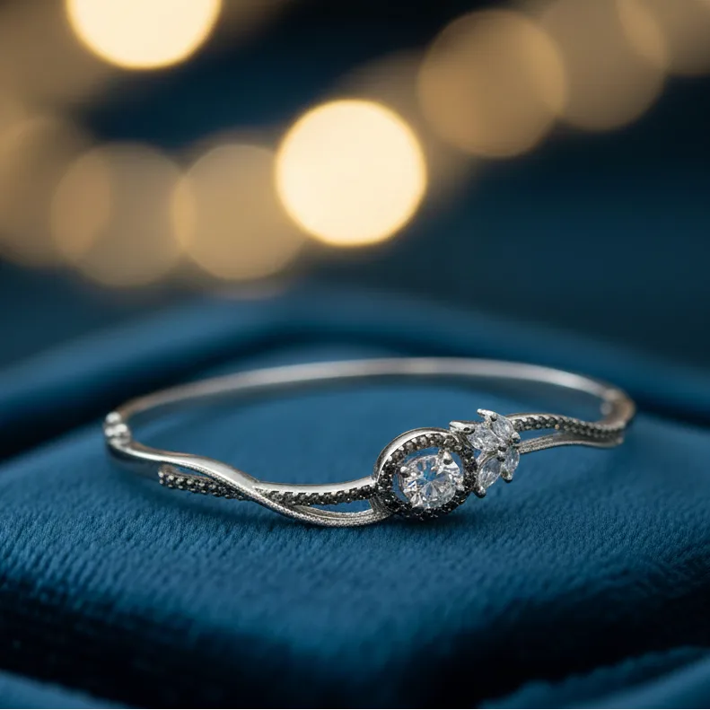 Silver ring with a diamond on a blue fabric background