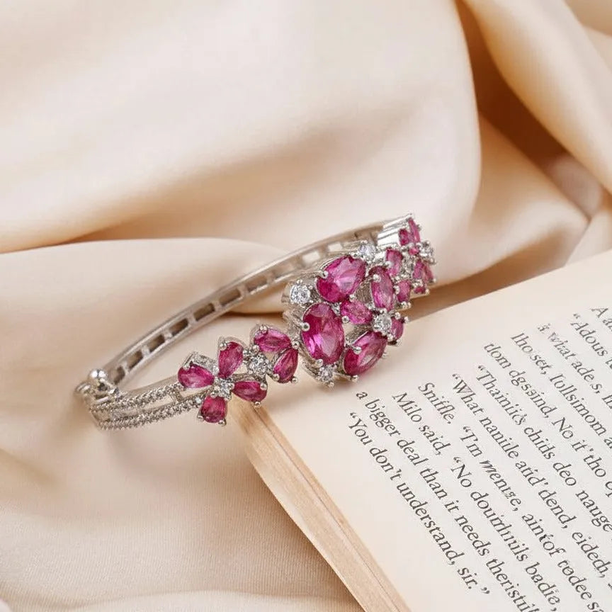Bracelet with pink gemstones on a book with text