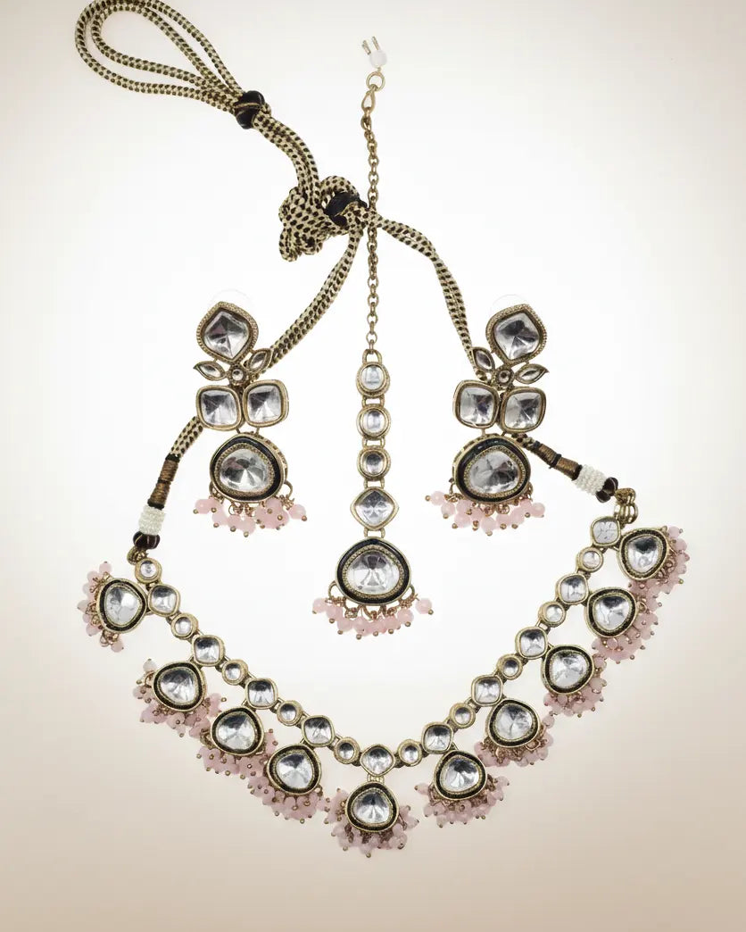 Decorative necklace with gemstones on a beige background