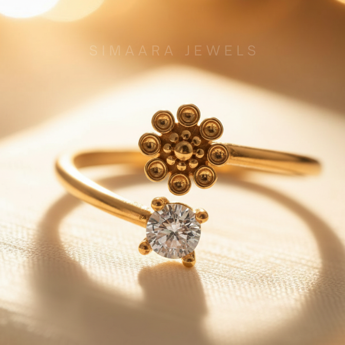 Gold ring with floral design and diamond on a beige background, featuring 'Simaara Jewels' branding.