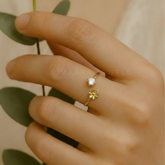 Gold bracelet with clear stones on a marble surface