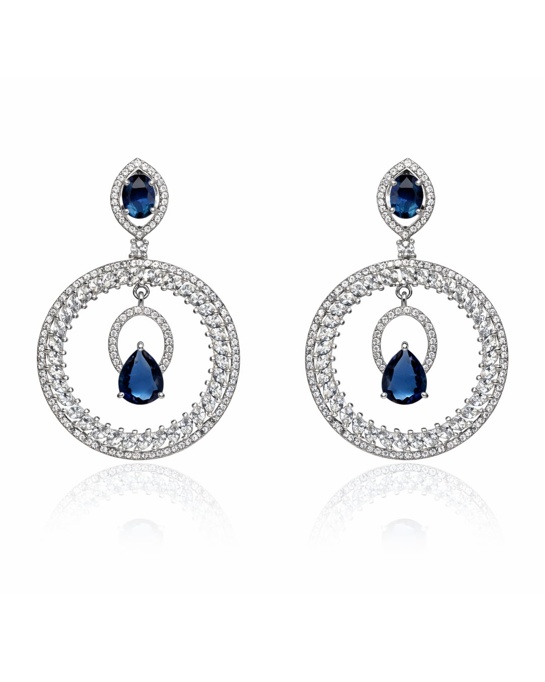Pair of earrings with blue gemstones and silver circular designs on a white background
