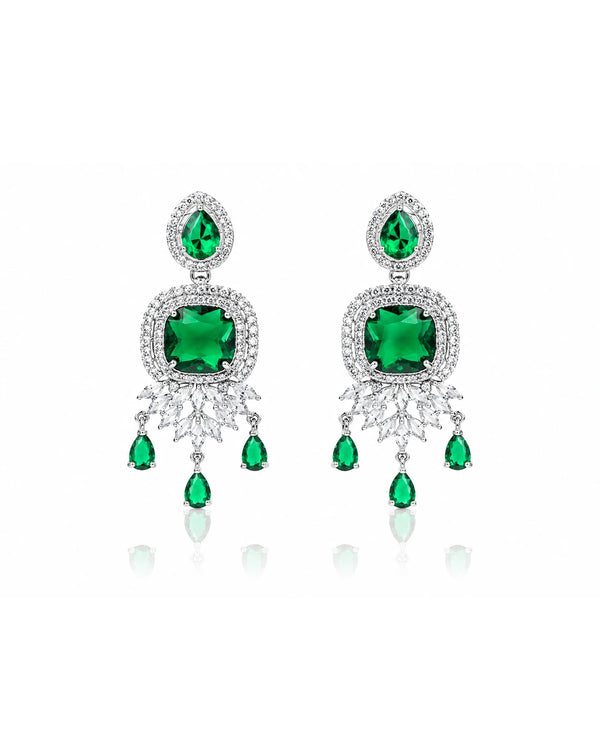 Pair of emerald green gemstone earrings with silver accents on a white background