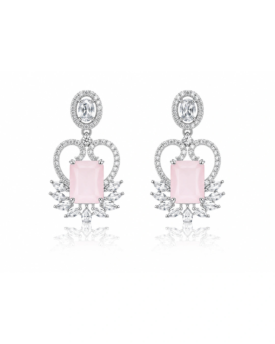 Pair of earrings with pink gemstones and diamond-like elements on a white background