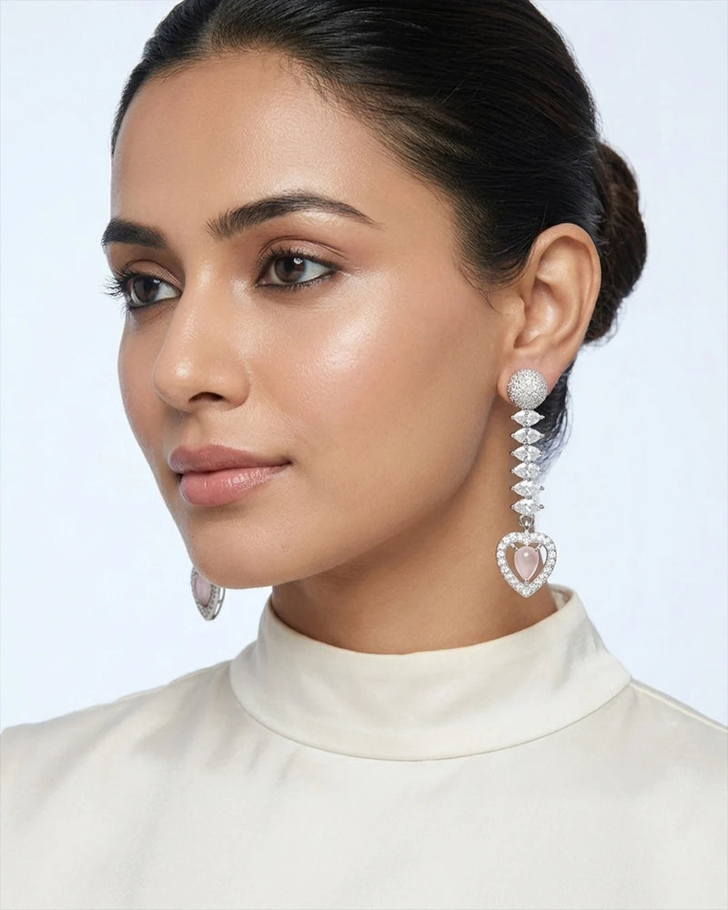 Woman wearing elegant earrings with a white background