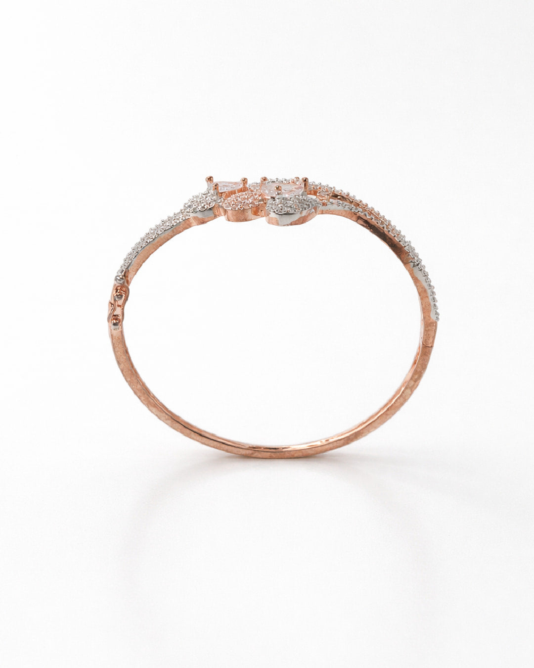 Rose gold bracelet with diamonds on a white background