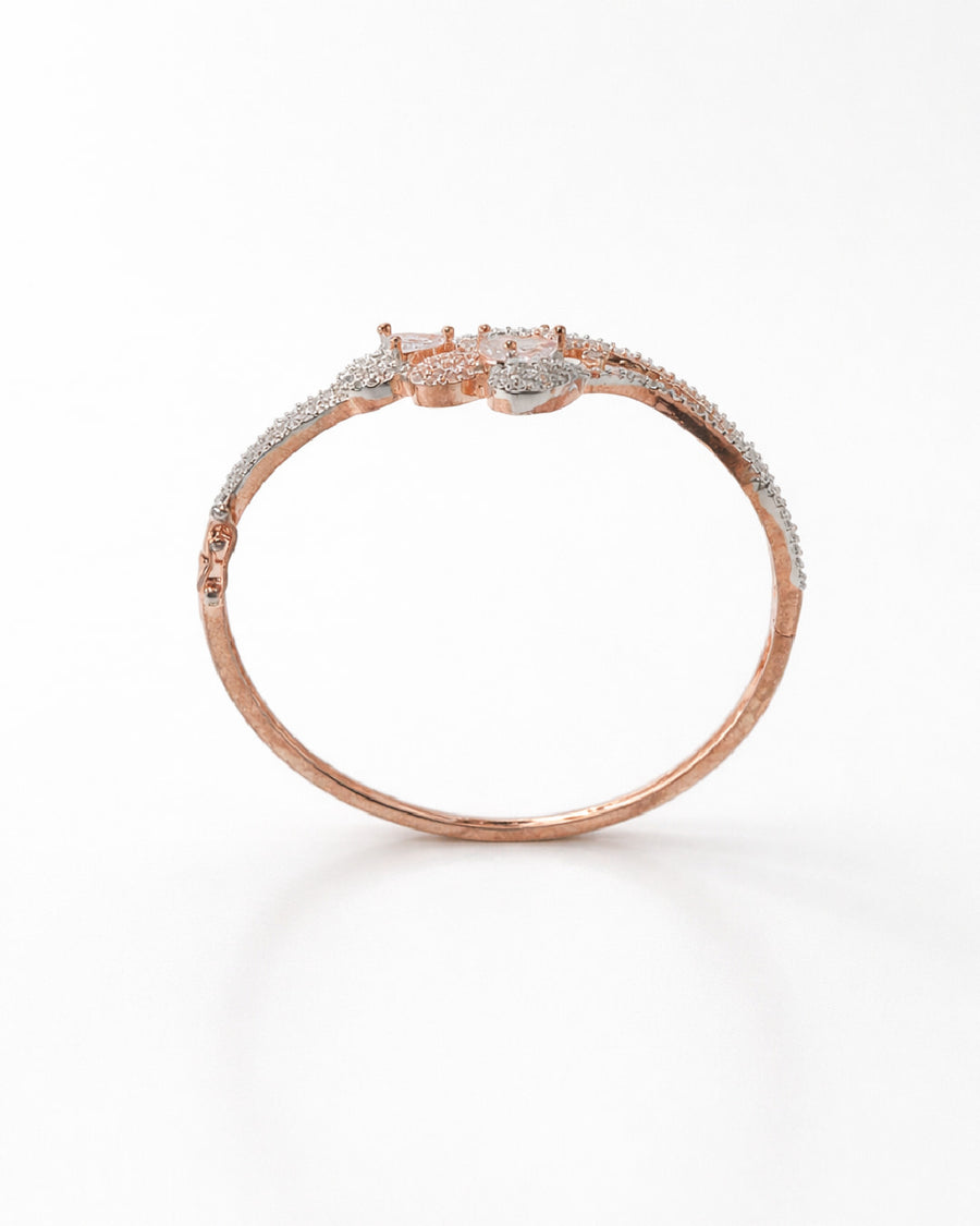 Rose gold bracelet with diamonds on a white background