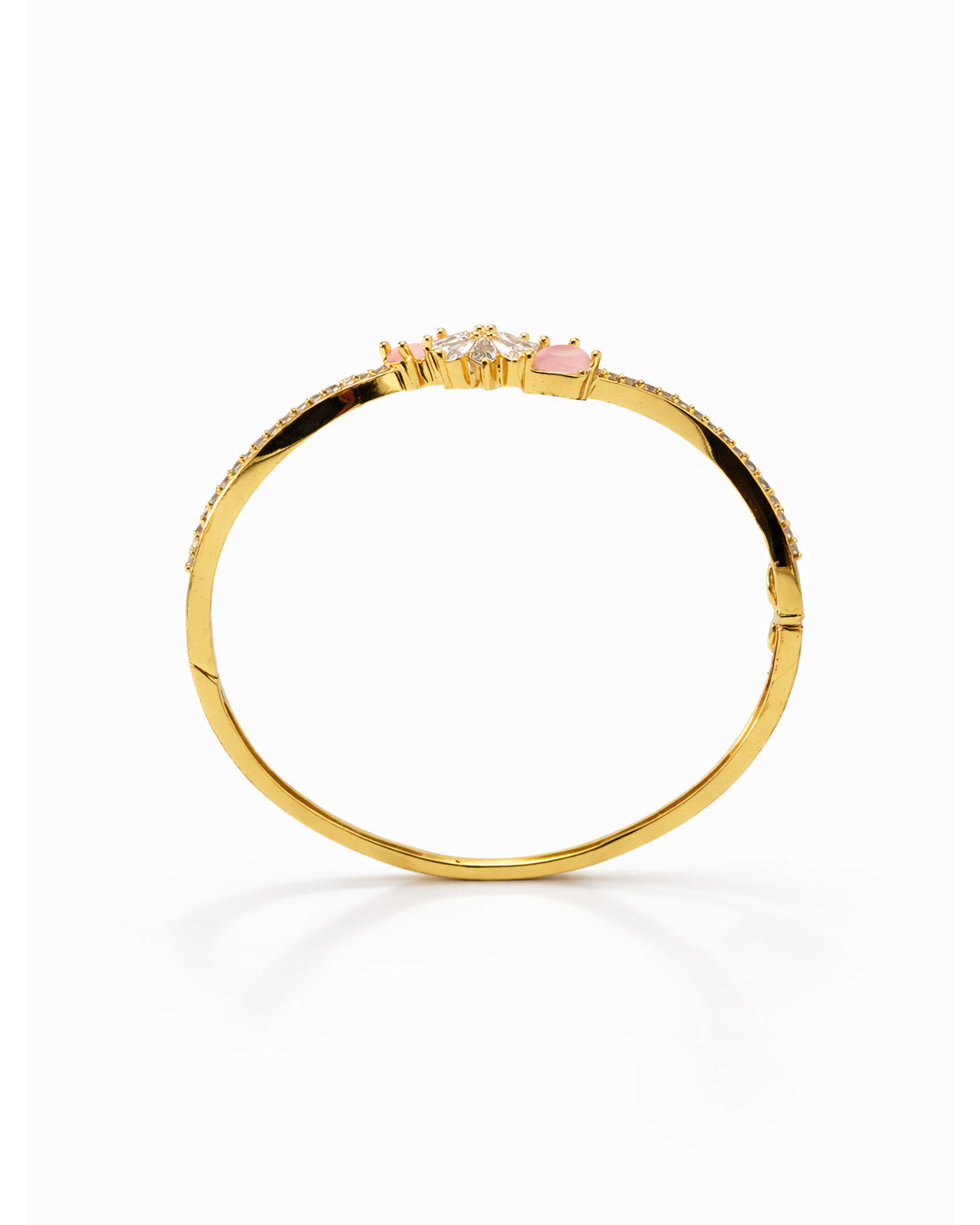 Gold bracelet with pink gemstone on a white background