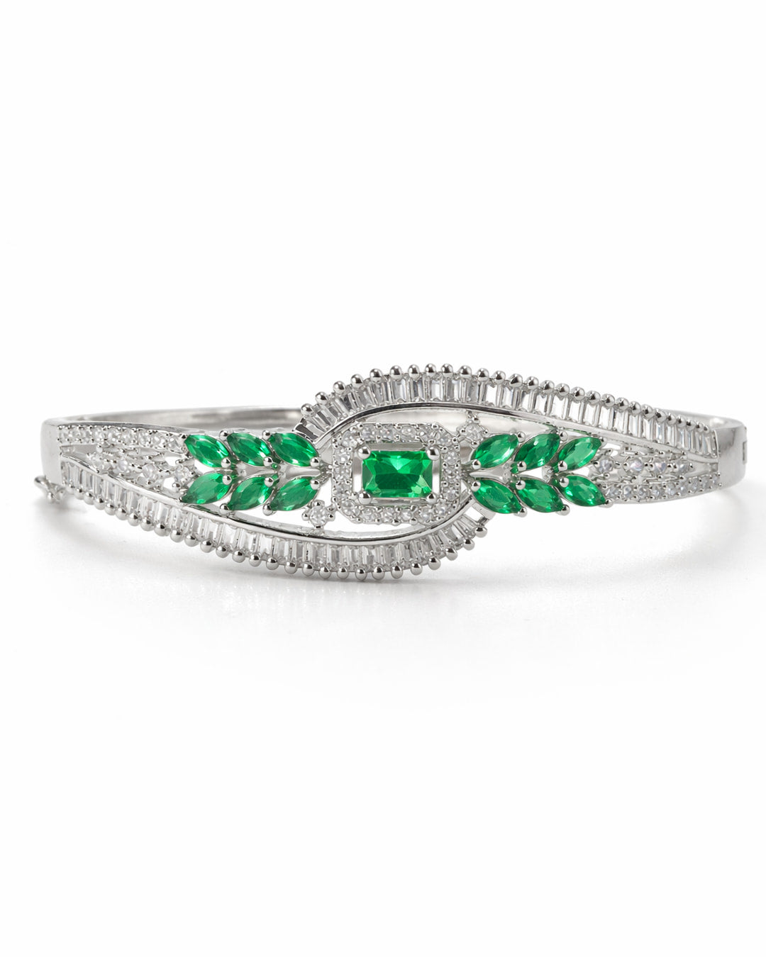 Silver bracelet with green gemstones on a white background