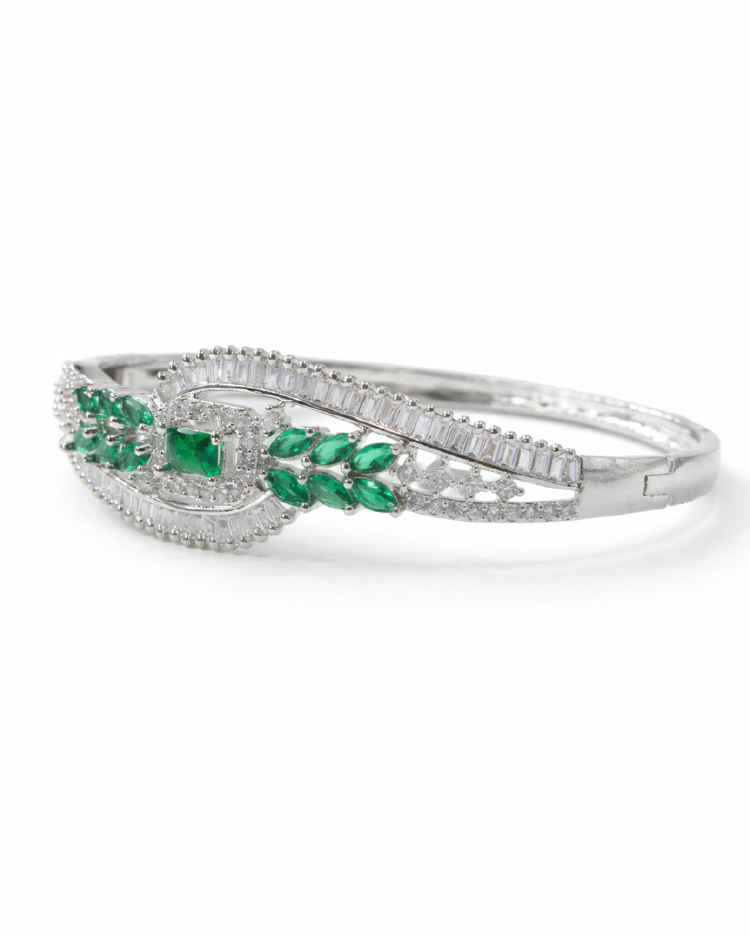 Silver bracelet with green gemstones on a white background