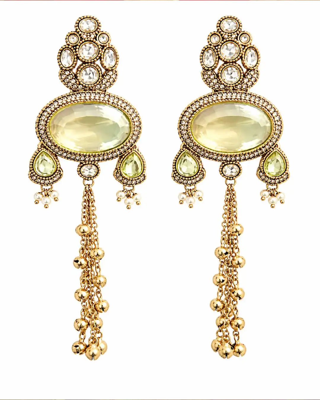 Ornate gold earrings with gemstones on a white background