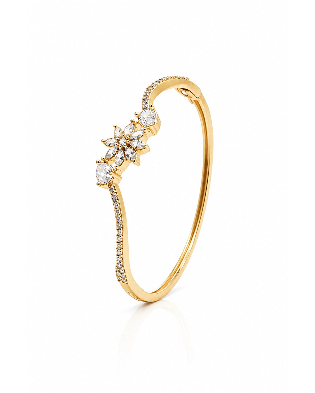 Gold bracelet with diamond accents on a white background