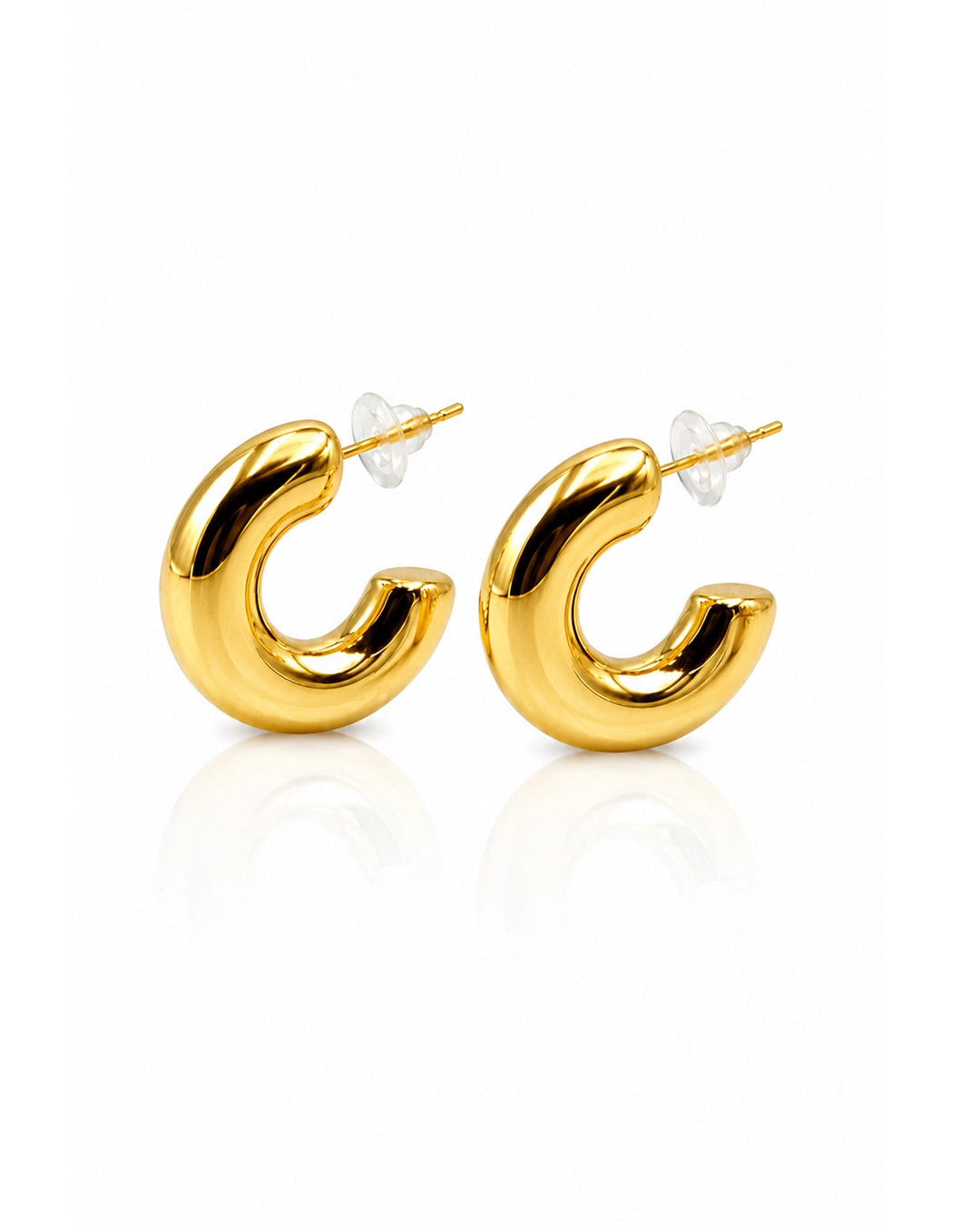 Gold hoop earrings on a white background