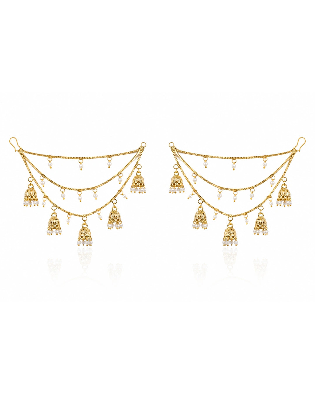 Pair of gold earrings with dangling charms on a white background