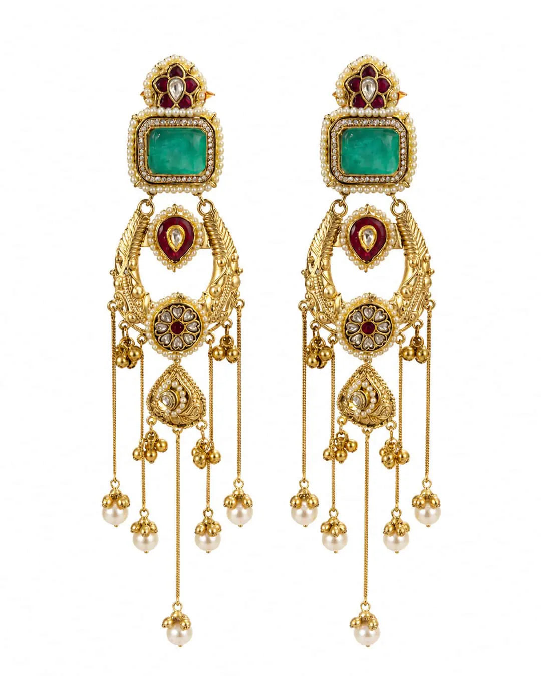 Ornate gold earrings with green gemstones and pearl drops on a white background