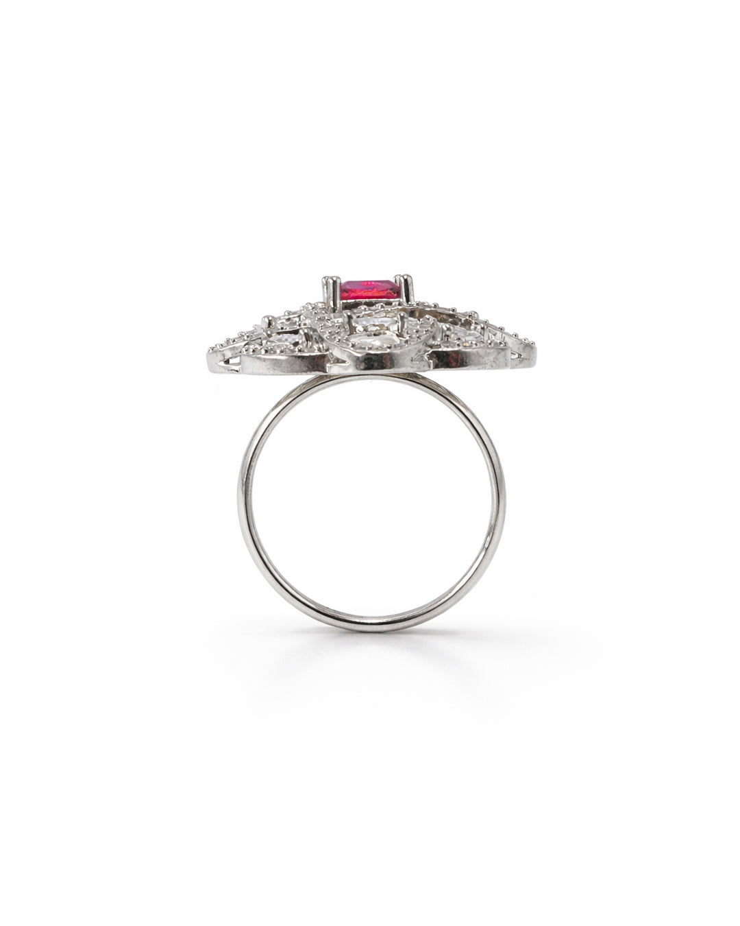 Silver ring with a red gemstone on a white background