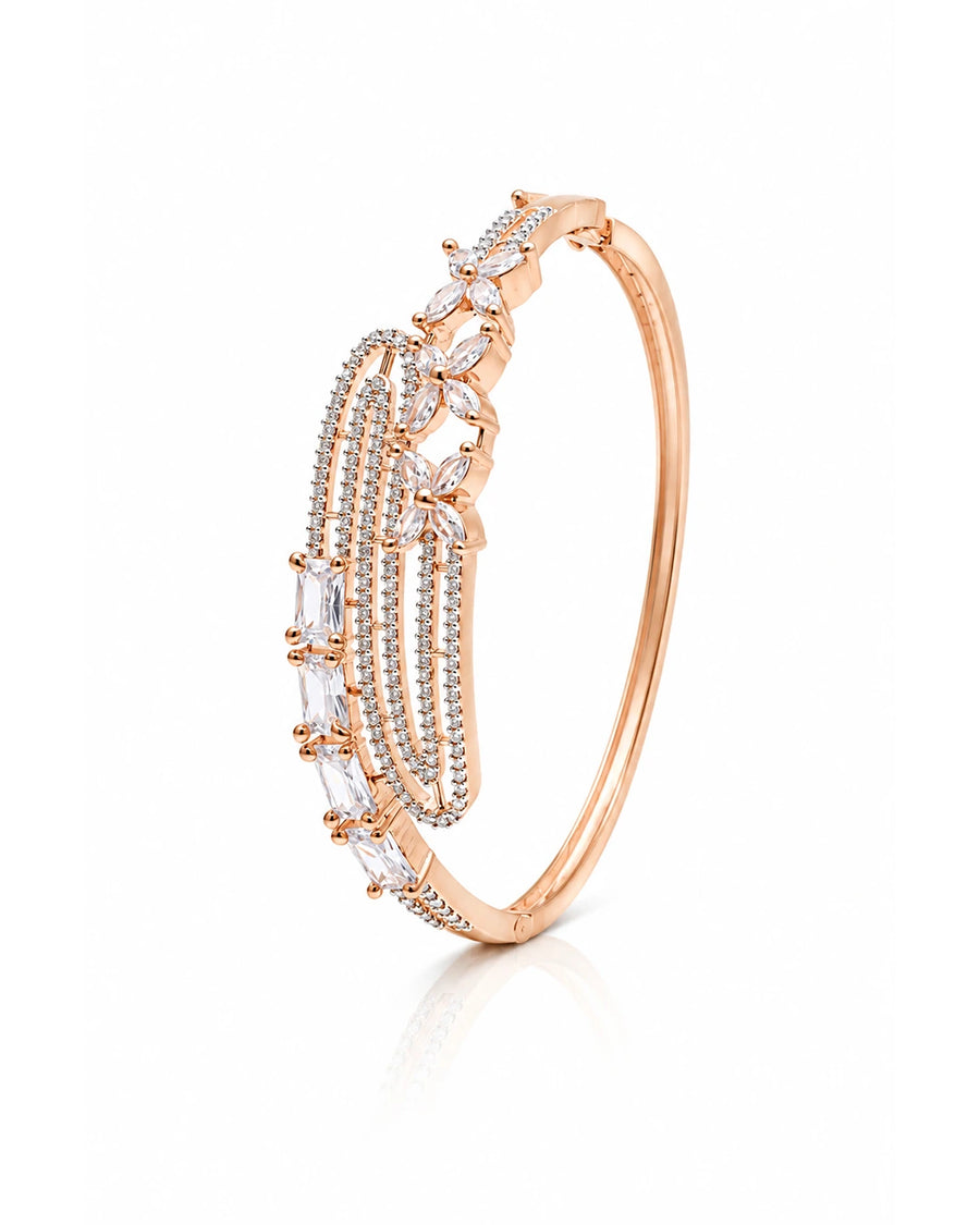 Rose gold bracelet with diamond accents on a white background