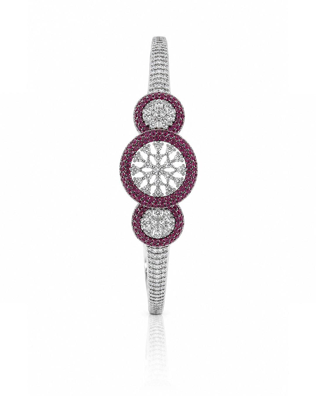 Elegant bracelet with circular design featuring rubies and diamonds on a white background