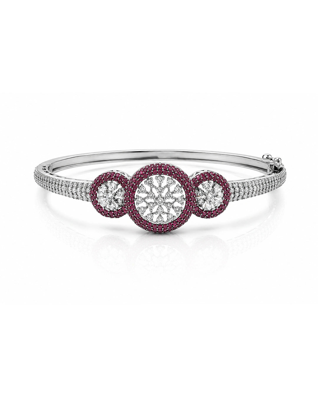 Silver bracelet with three circular gemstones on a white background